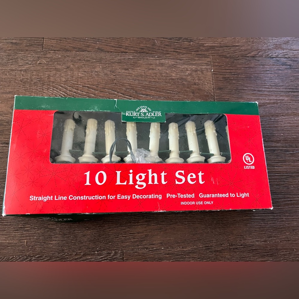 Vintage New in box Kurt Adler 10 light set melted candle look.  Brand new.